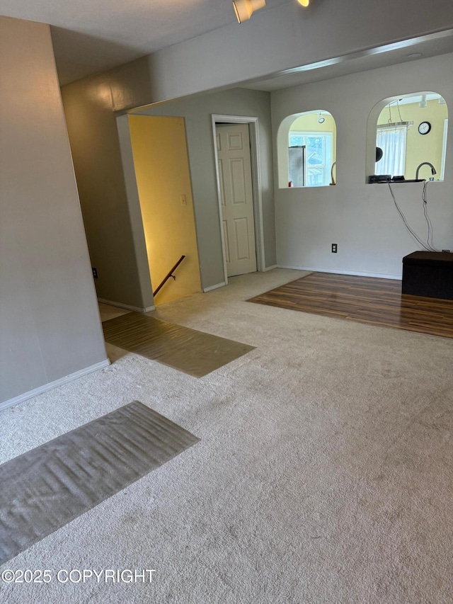 2090 Dimond Dr, Anchorage, AK 99507 - unfurnished room featuring carpet floors and arched walkways