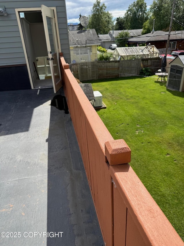 2090 Dimond Dr, Anchorage, AK 99507 - fenced backyard with french doors