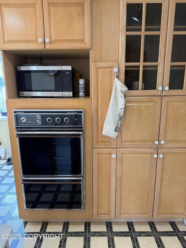 2090 Dimond Dr, Anchorage, AK 99507 - kitchen featuring stainless steel microwave, oven, light brown cabinetry, and light floors