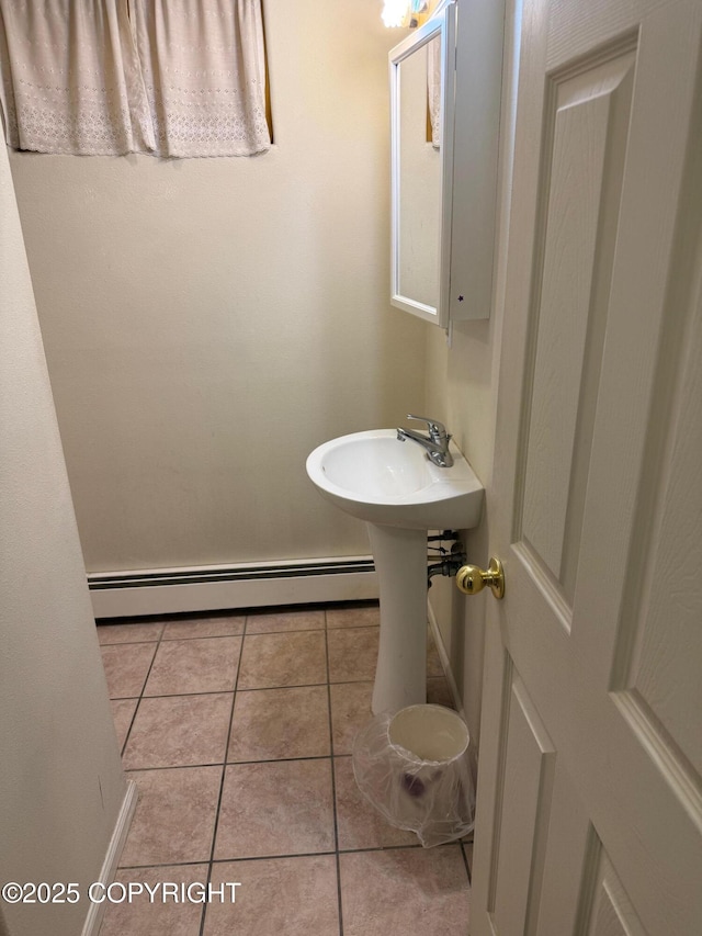 2090 Dimond Dr, Anchorage, AK 99507 - bathroom with a baseboard radiator and tile patterned flooring