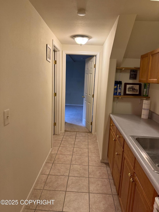 2090 Dimond Dr, Anchorage, AK 99507 - corridor with a sink and light tile patterned flooring
