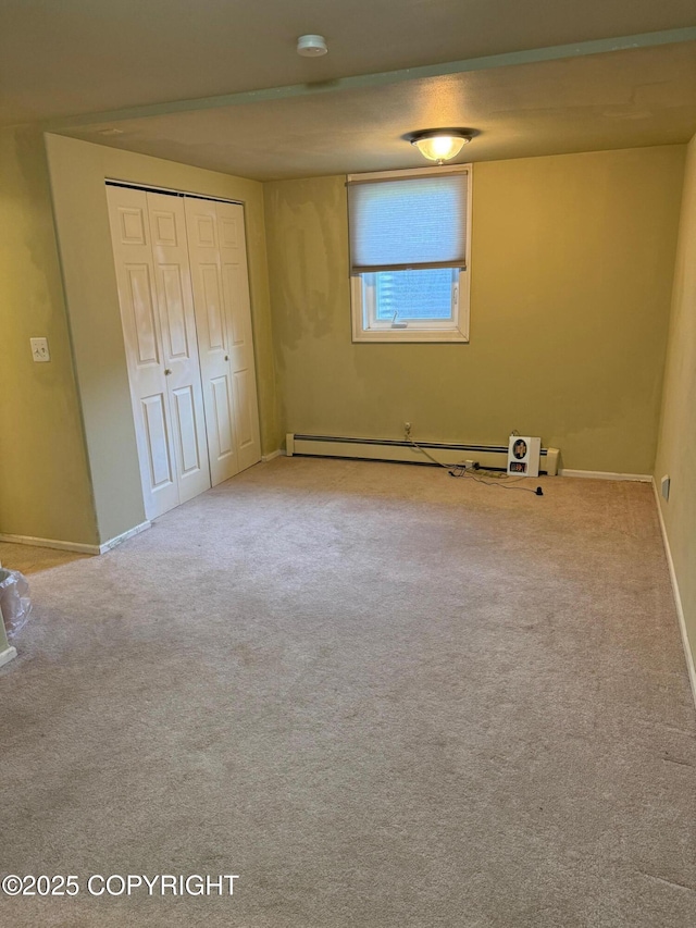 2090 Dimond Dr, Anchorage, AK 99507 - unfurnished bedroom with a baseboard heating unit, a closet, and carpet floors