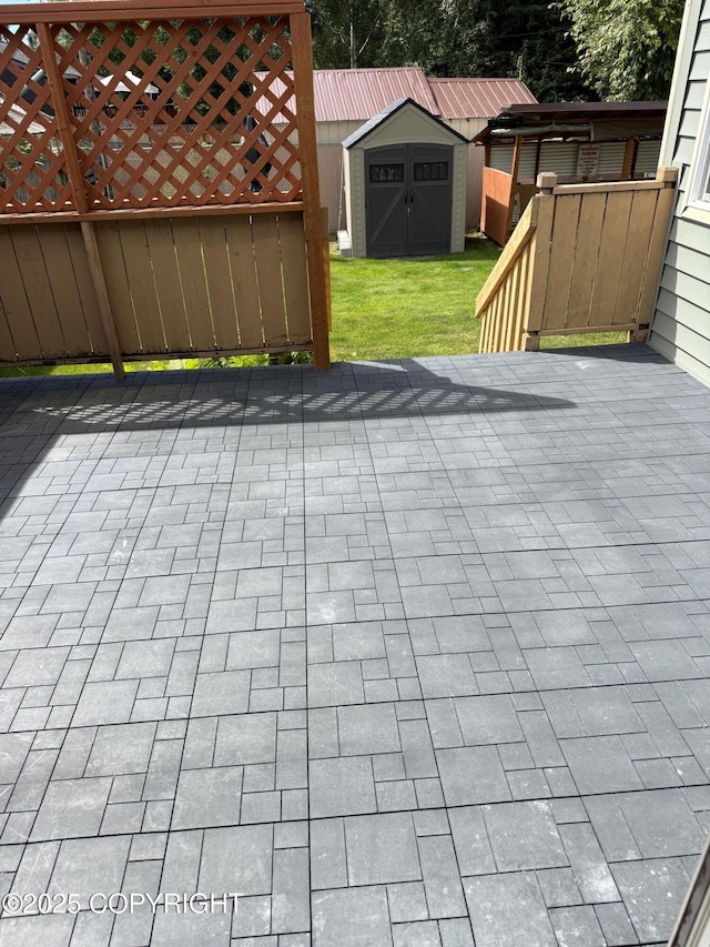 2090 Dimond Dr, Anchorage, AK 99507 - view of patio with a storage unit
