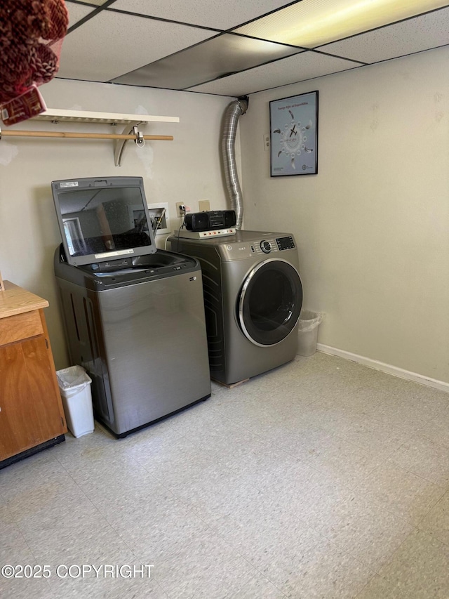 2090 Dimond Dr, Anchorage, AK 99507 - laundry area featuring washing machine and dryer and tile patterned floors