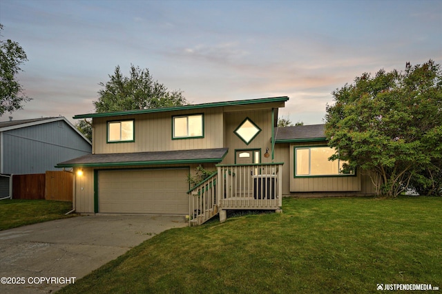 260 N Gloria St, Palmer, AK 99645 - view of front of property featuring a garage, driveway, and a lawn