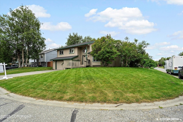 260 N Gloria St, Palmer, AK 99645 - view of front of property featuring a garage, driveway, and a front lawn