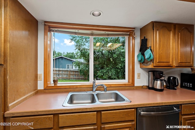 260 N Gloria St, Palmer, AK 99645 - kitchen with stainless steel dishwasher, light countertops, black microwave, and brown cabinets