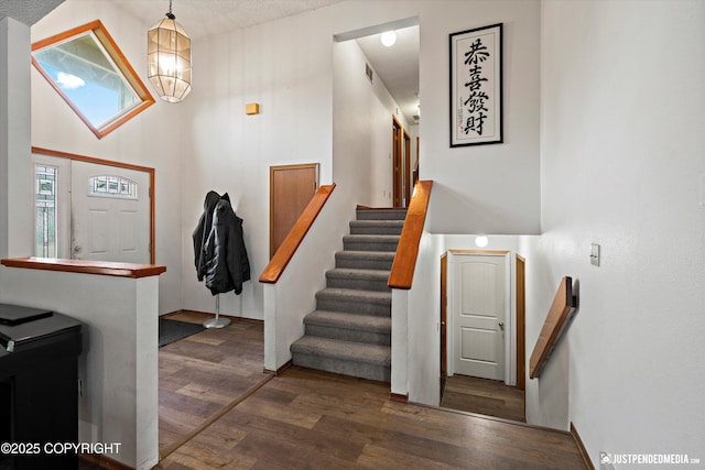 260 N Gloria St, Palmer, AK 99645 - entrance foyer with wood finished floors, stairway, and a chandelier