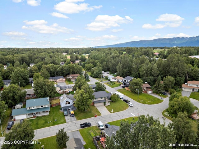 260 N Gloria St, Palmer, AK 99645 - aerial perspective of suburban area featuring a mountainous background and a heavily wooded area