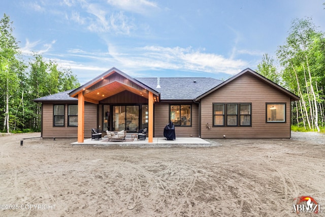 365 W Crestwood Ave, Wasilla, AK 99654 - rear view of property with a patio area, an outdoor living space, and roof with shingles