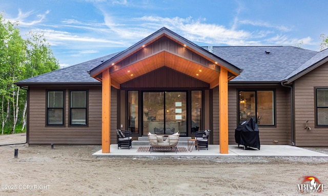 365 W Crestwood Ave, Wasilla, AK 99654 - back of property with a patio, a shingled roof, and outdoor lounge area
