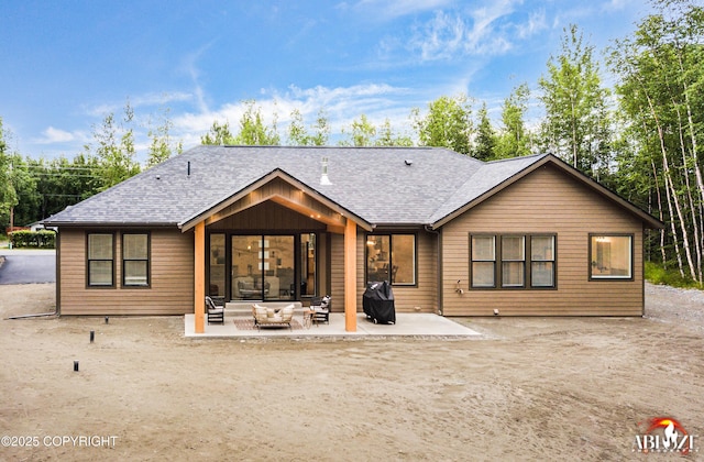 365 W Crestwood Ave, Wasilla, AK 99654 - rear view of property with a patio and a shingled roof