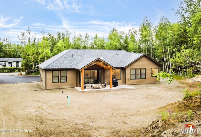 365 W Crestwood Ave, Wasilla, AK 99654 - back of house with a patio and view of scattered trees