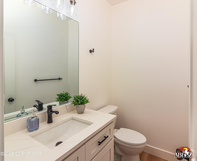 365 W Crestwood Ave, Wasilla, AK 99654 - half bathroom featuring vanity and wood finished floors