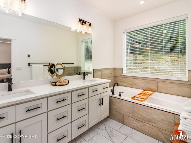 365 W Crestwood Ave, Wasilla, AK 99654 - full bath with marble look tiles, a garden tub, double vanity, and recessed lighting