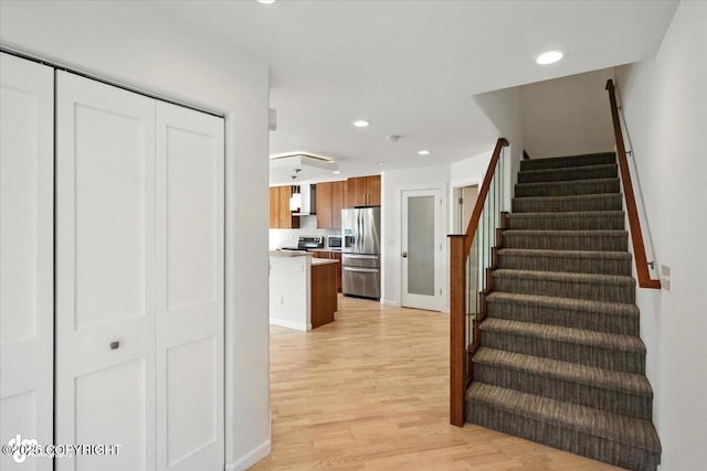 2350 Canary Ct, Anchorage, AK 99515 - stairway featuring wood finished floors and recessed lighting