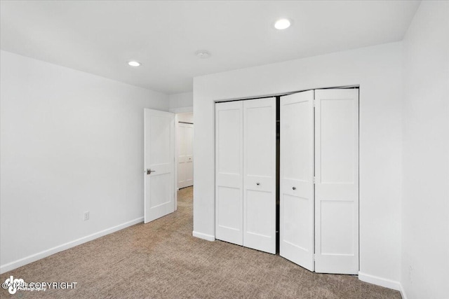2350 Canary Ct, Anchorage, AK 99515 - unfurnished bedroom with carpet floors, recessed lighting, and a closet