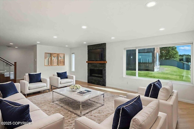 2350 Canary Ct, Anchorage, AK 99515 - living area with healthy amount of natural light, recessed lighting, a large fireplace, and wood finished floors