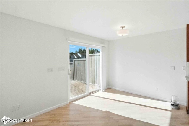 2350 Canary Ct, Anchorage, AK 99515 - unfurnished room with baseboards and wood finished floors