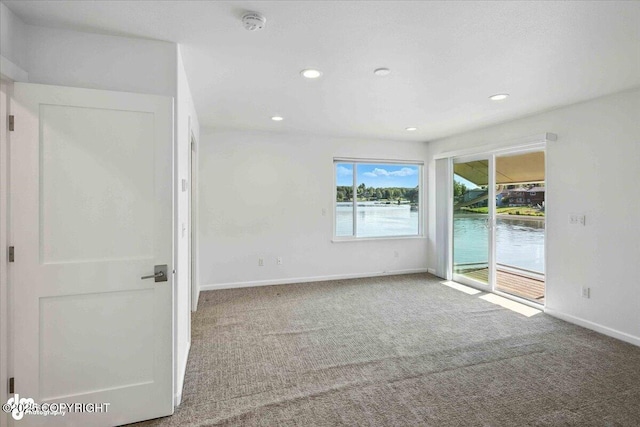 2350 Canary Ct, Anchorage, AK 99515 - empty room with carpet, recessed lighting, and a water view