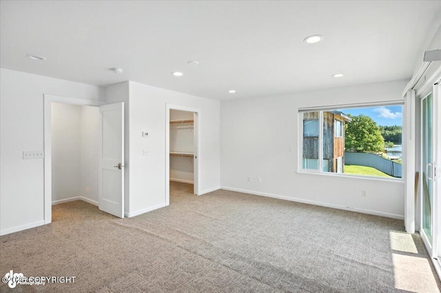 2350 Canary Ct, Anchorage, AK 99515 - unfurnished bedroom featuring carpet, recessed lighting, and a walk in closet