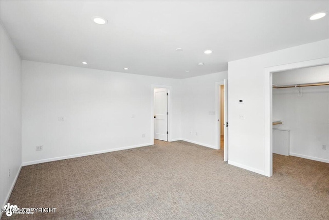 2350 Canary Ct, Anchorage, AK 99515 - unfurnished bedroom with recessed lighting, carpet floors, and a walk in closet