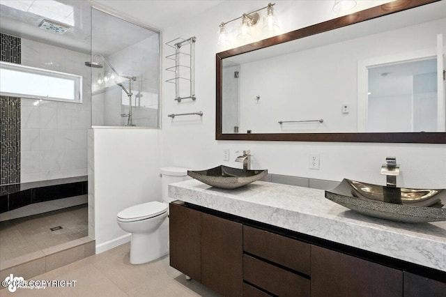 2350 Canary Ct, Anchorage, AK 99515 - full bathroom with double vanity, a walk in shower, and tile patterned flooring