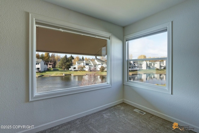 2350 Canary Ct, Anchorage, AK 99515 - spare room featuring a water view and carpet