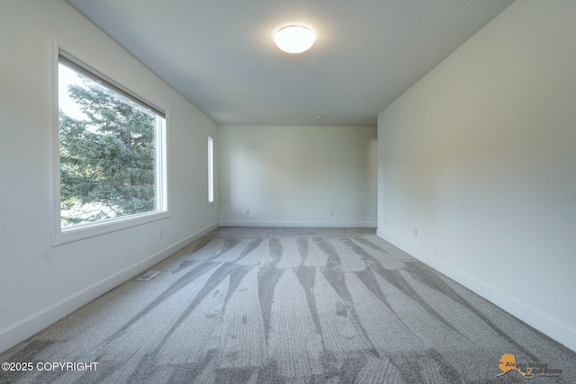 2350 Canary Ct, Anchorage, AK 99515 - unfurnished room with light carpet and baseboards