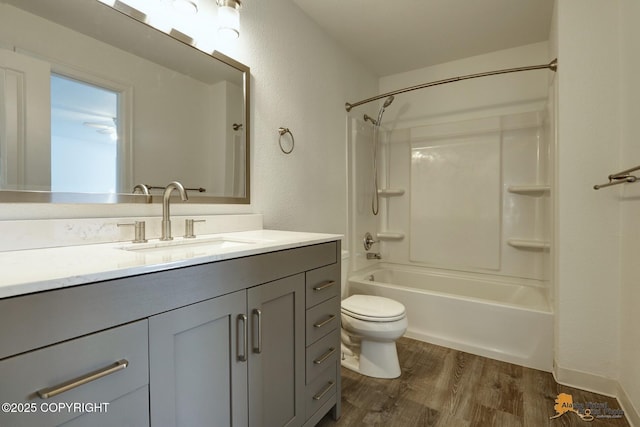2350 Canary Ct, Anchorage, AK 99515 - full bathroom featuring wood finished floors, vanity, shower / washtub combination, and a textured wall