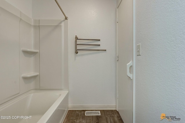 2350 Canary Ct, Anchorage, AK 99515 - full bath featuring wood finished floors and shower / bath combination
