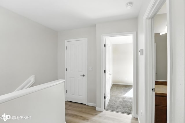 133 Matthew Paul Way, Anchorage, AK 99504 - hallway with light wood-style floors and an upstairs landing