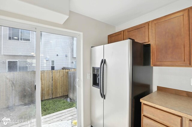 133 Matthew Paul Way, Anchorage, AK 99504 - kitchen with fridge with ice dispenser and brown cabinets