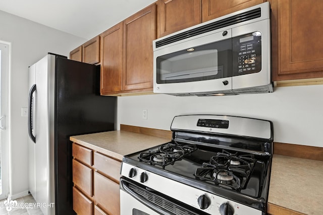 133 Matthew Paul Way, Anchorage, AK 99504 - kitchen with stainless steel appliances and brown cabinets