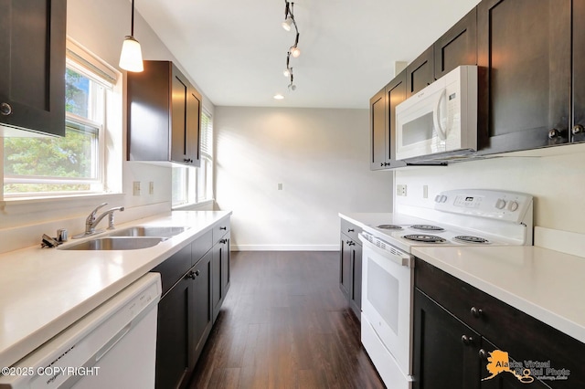 1414 W 7th Ave # 2, Anchorage, AK 99501 - kitchen featuring white appliances, dark wood finished floors, light countertops, and dark brown cabinets