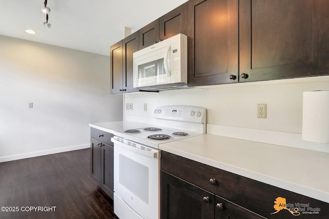 1414 W 7th Ave # 2, Anchorage, AK 99501 - kitchen featuring white appliances, light countertops, dark wood finished floors, and dark brown cabinets