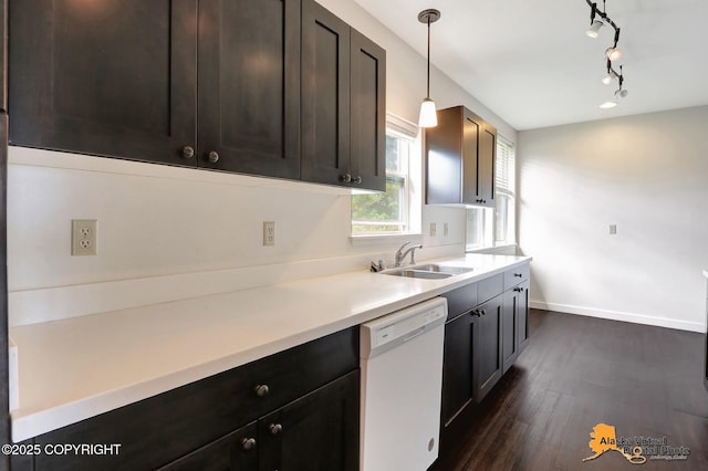 1414 W 7th Ave # 2, Anchorage, AK 99501 - kitchen with white dishwasher, dark wood-style floors, light countertops, decorative light fixtures, and dark brown cabinets