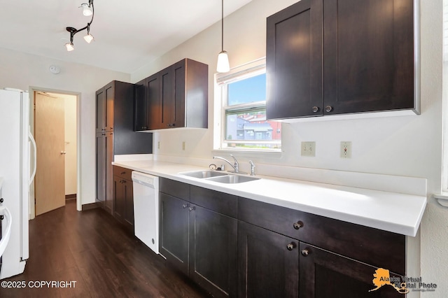 1414 W 7th Ave # 2, Anchorage, AK 99501 - kitchen featuring white appliances, dark wood-style flooring, light countertops, dark brown cabinets, and hanging light fixtures