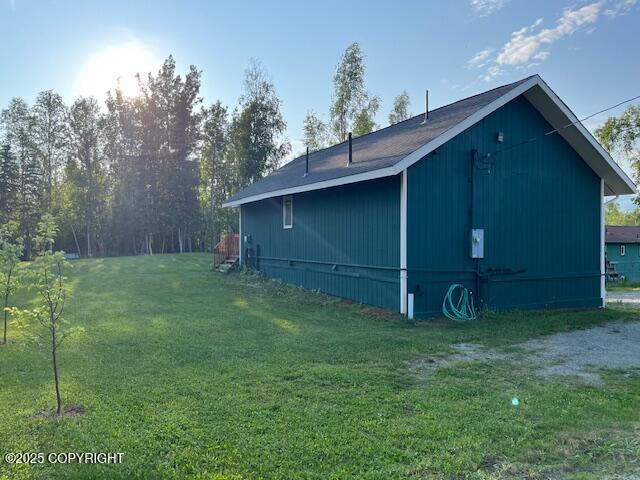 3021 N Arctic Fox Dr, Wasilla, AK 99654 - view of side of property with a yard