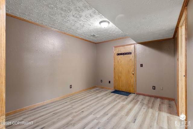 3021 N Arctic Fox Dr, Wasilla, AK 99654 - unfurnished room with crown molding, light wood finished floors, and a textured ceiling