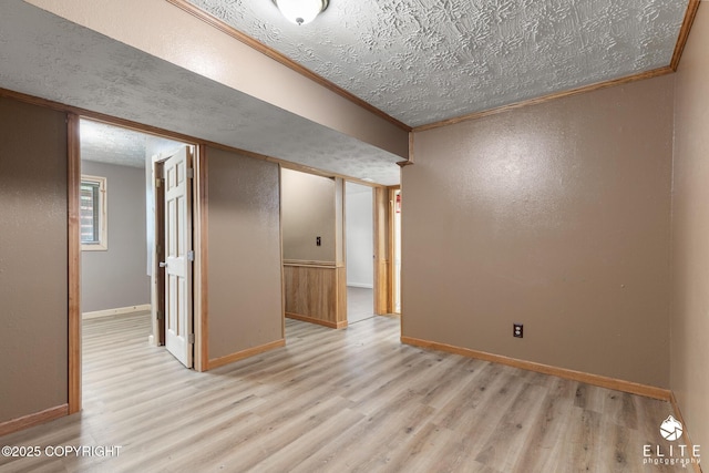 3021 N Arctic Fox Dr, Wasilla, AK 99654 - spare room with wood finished floors, crown molding, and a textured ceiling