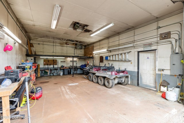 3021 N Arctic Fox Dr, Wasilla, AK 99654 - garage with electric panel and a workshop area