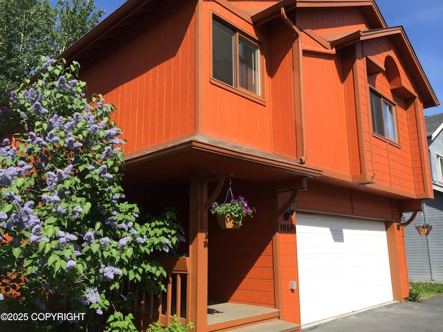 4060 Defiance St, Anchorage, AK 99504 - view of front of property featuring a garage
