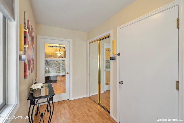 4060 Defiance St, Anchorage, AK 99504 - hall with light wood-style floors and plenty of natural light