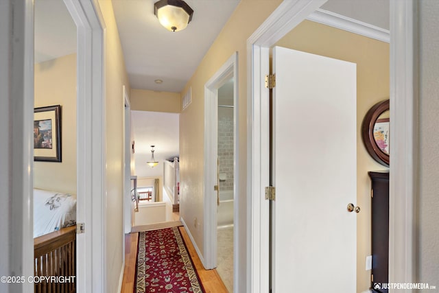 4060 Defiance St, Anchorage, AK 99504 - hallway featuring light wood-style flooring and baseboards