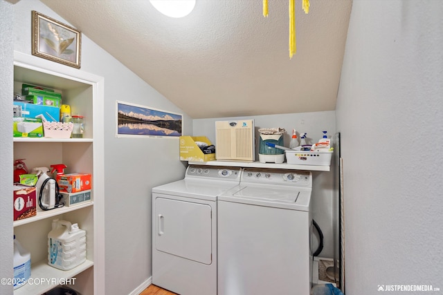 4060 Defiance St, Anchorage, AK 99504 - laundry area with washing machine and clothes dryer and a textured ceiling