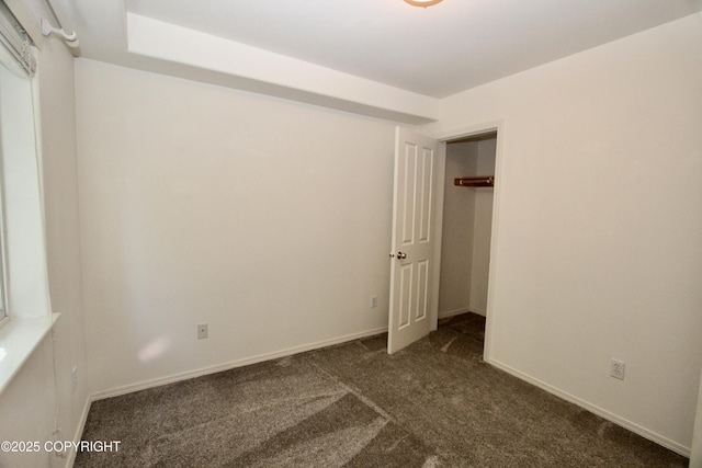 11613 Birch Knoll Loop, Anchorage, AK 99515 - unfurnished bedroom with dark carpet and baseboards