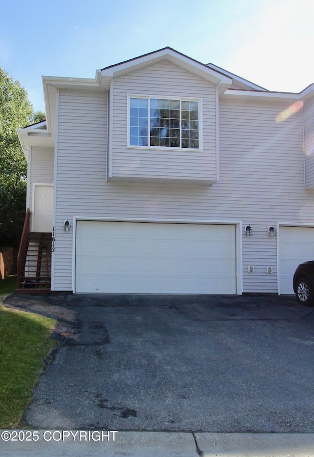 11613 Birch Knoll Loop, Anchorage, AK 99515 - view of side of home featuring a garage and driveway