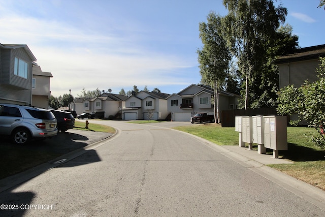 11613 Birch Knoll Loop, Anchorage, AK 99515 - view of asphalt road with a residential view and curbs