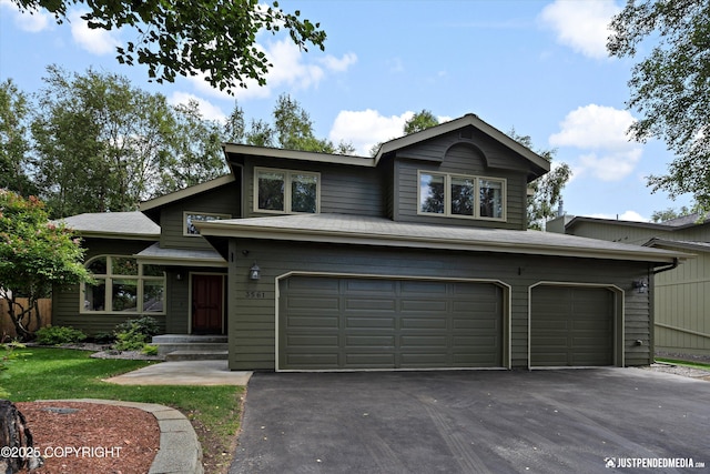 3561 Eastwind Dr, Anchorage, AK 99516 - view of front facade with a garage and driveway